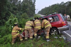 fire fighters helping a car wreck